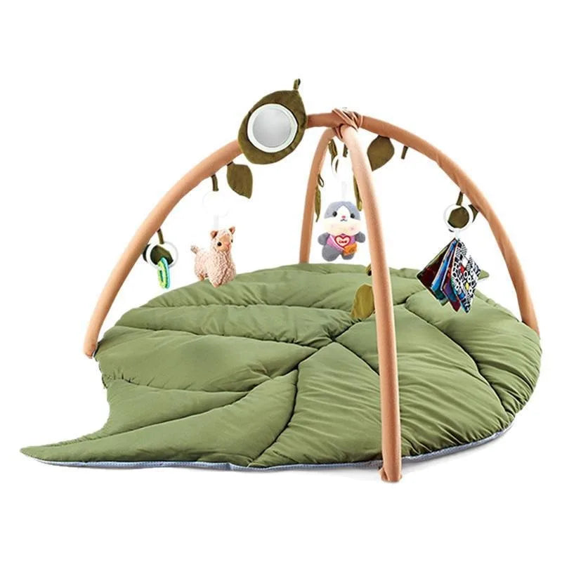 Green leaf-shaped baby play mat with arches and dangling toys