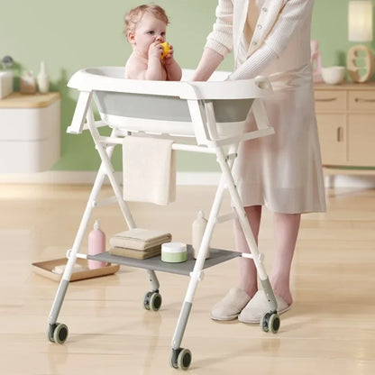 White foldable baby bath tub with adjustable stand and wheels